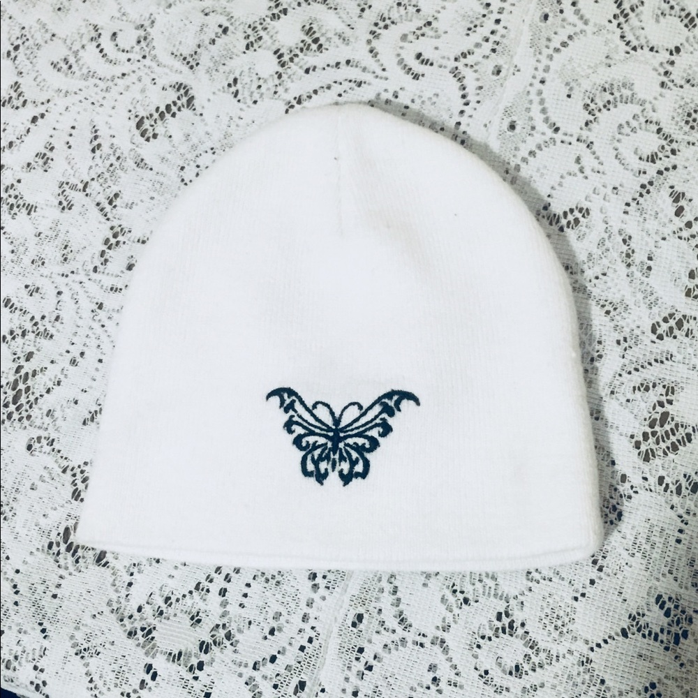 White beanie with butterfly detail